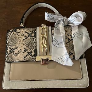 Aldo faux rattlesnake gold hardware ribboned handbag